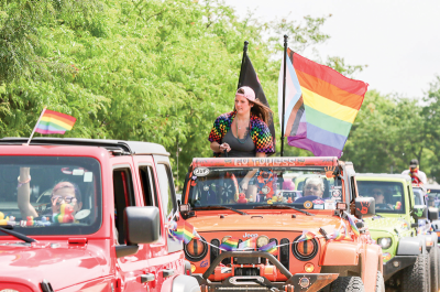  LGBTQIA+ flags fly proudly as decorated Jeeps  drive in the first Pride Parade in Warren. 