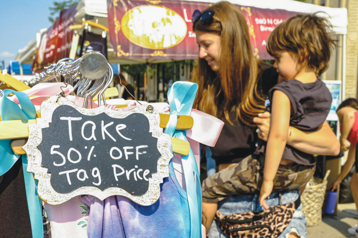  Shoppers enjoy discounts at a past Day on the Town event. 