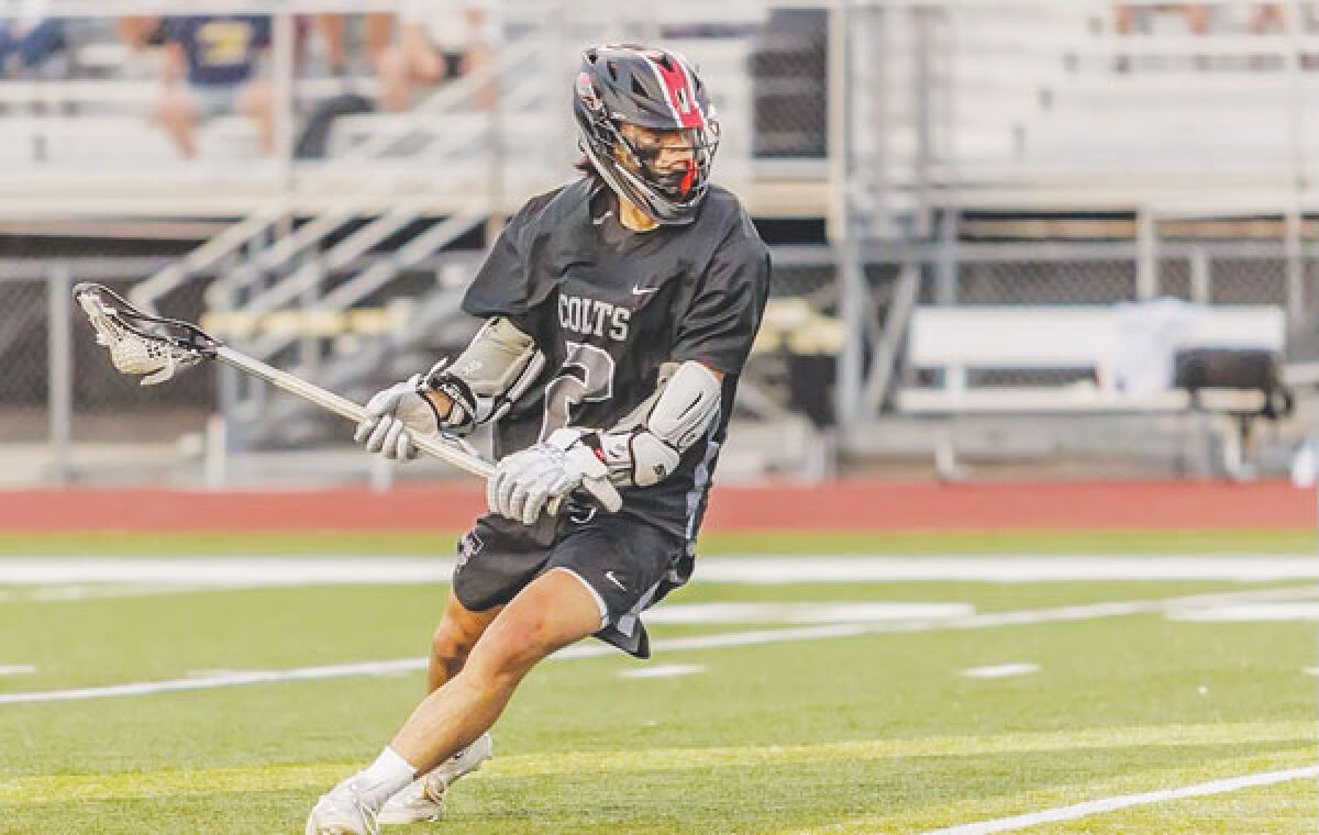  Troy senior Michael Lim controls the ball during a game this year. The team won its first Oakland Activities Association league championship. 