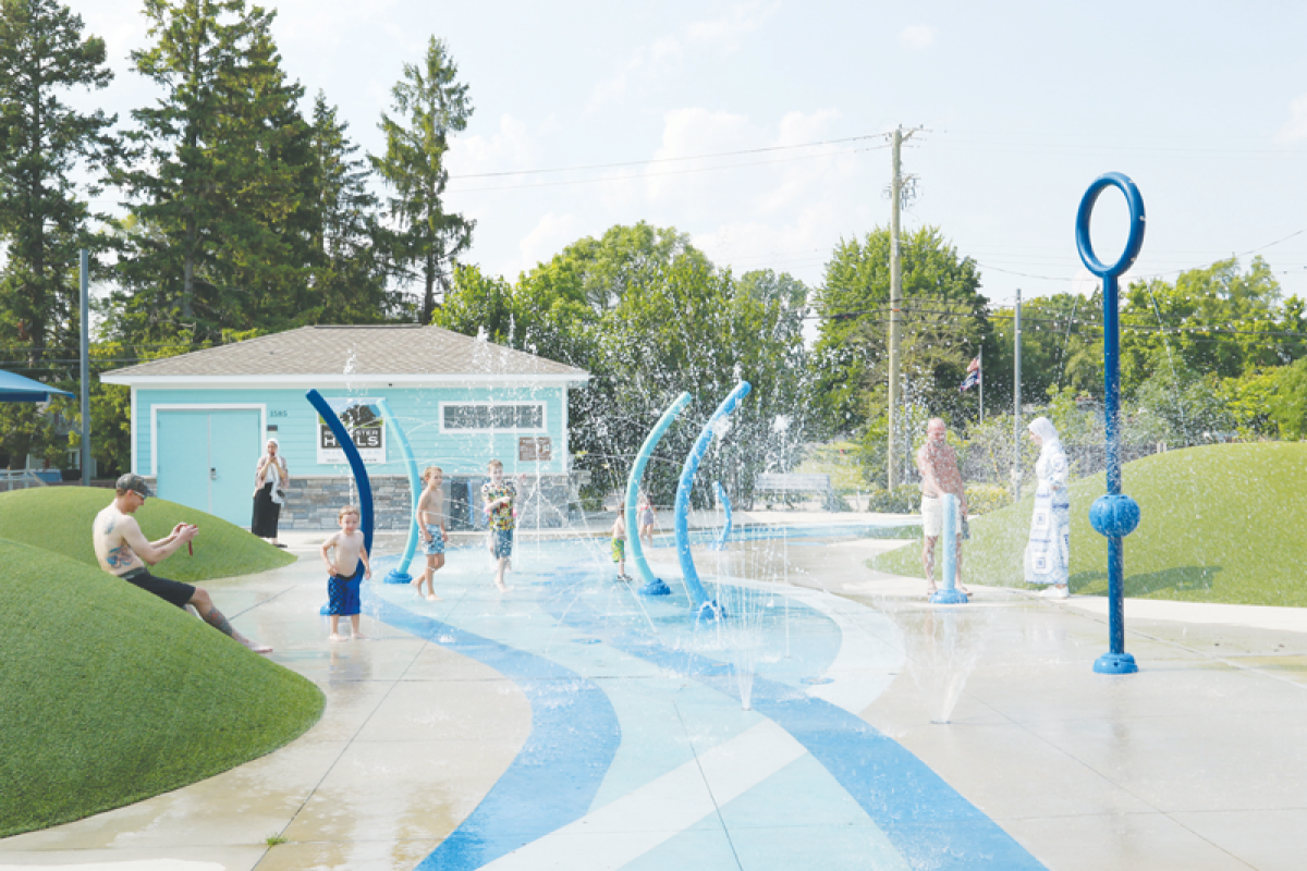  Children enjoy cooling off in the water at the Brooklands Splash Pad after its reopening. 