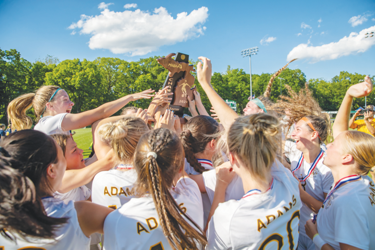  Rochester Adams girls soccer celebrates a 2-0 win over Hartland in the Michigan High School Athletic Association Division 1 state championship June 14 at DeMartin Stadium in East Lansing. 