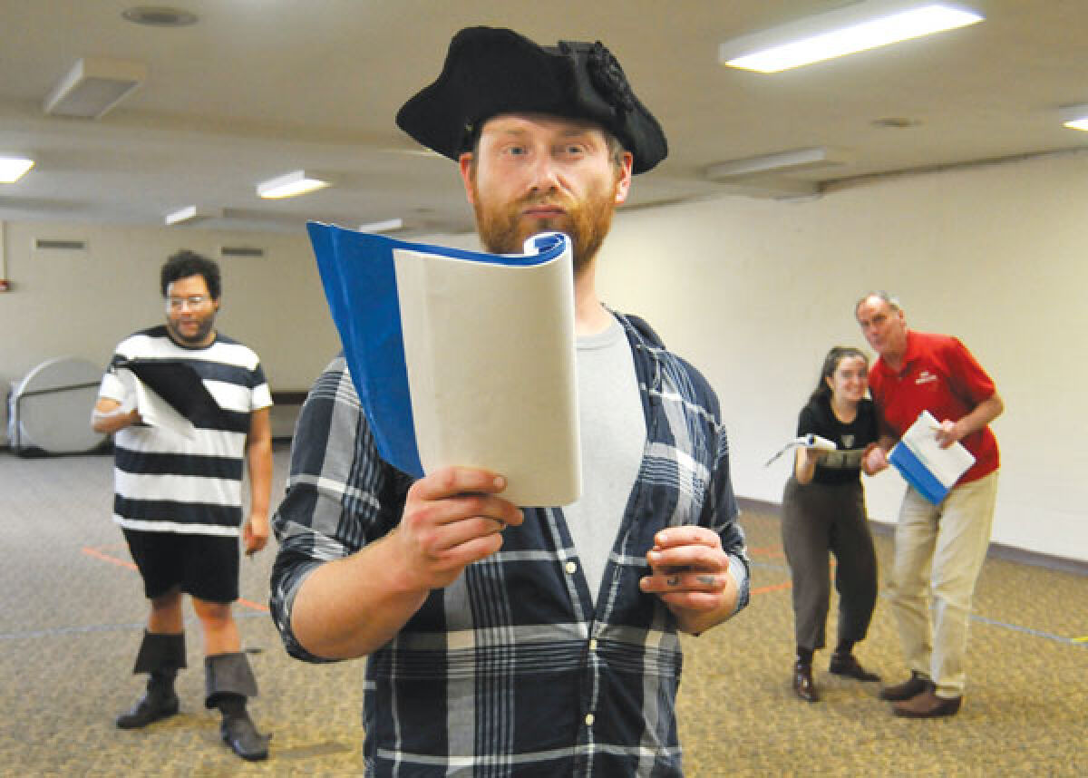  Ryan Ernst, in front, and Dan Johnson, Kerry Milliron and Olivia Kiefer work on blocking and dialogue for “Twelfth Night.” 