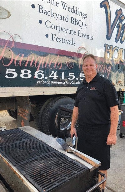   Anthony Jekielek, who has owned The Vintage House for the past 15 years, works at an off-site catering event. 