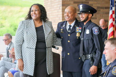  Southfield Police Chief Elvin Barren welcomes newly sworn-in Officer Carlos Toombs, who had his badge pinned by his mother, Valerie Payne. 