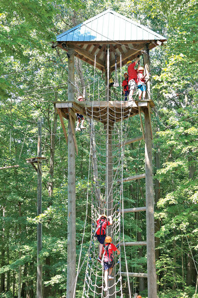  Kids tackle the Walled Lake Adventure Course at the Walled Lake Outdoor Education Center on July 15 as part of the Novi Police and Fire Youth Leadership Academy. 