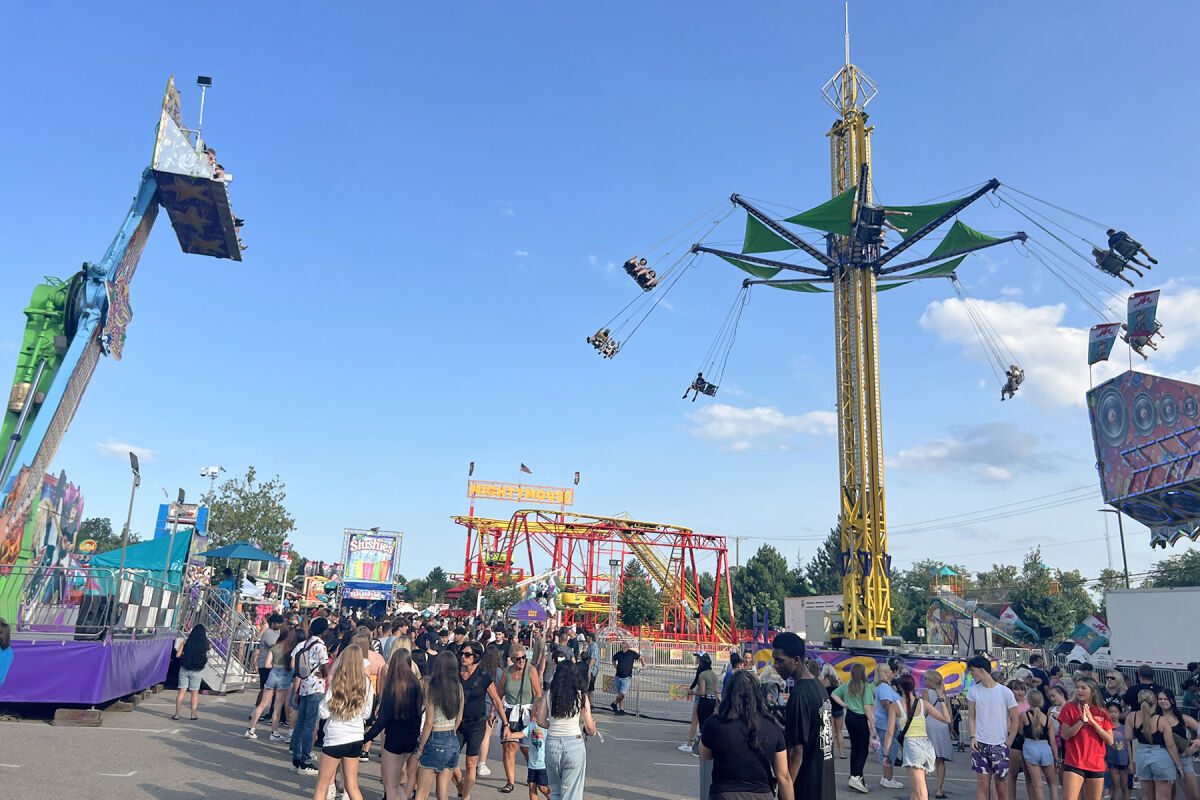  The amusement rides are in action at the Sterlingfest Art & Music Fair’s carnival midway Thursday, July 25.  