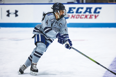  Yale University captain Elle Hartje controls the puck during a game earlier this year. 