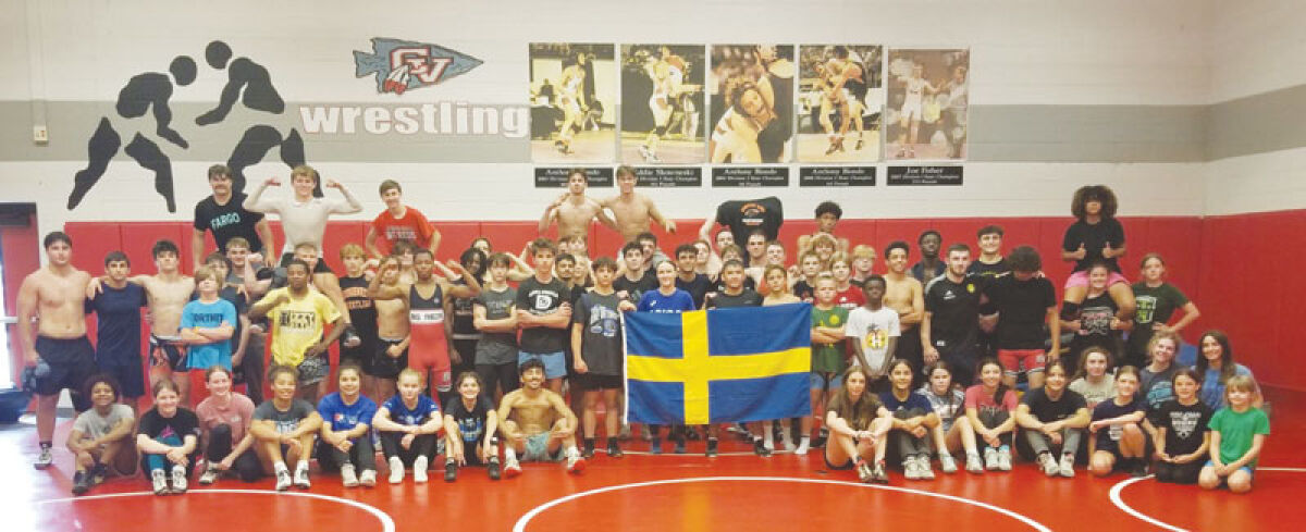  The Vasteras Wrestling Club of Sweden and the Viking Roughneck Wrestling Club pose for a group photo. 