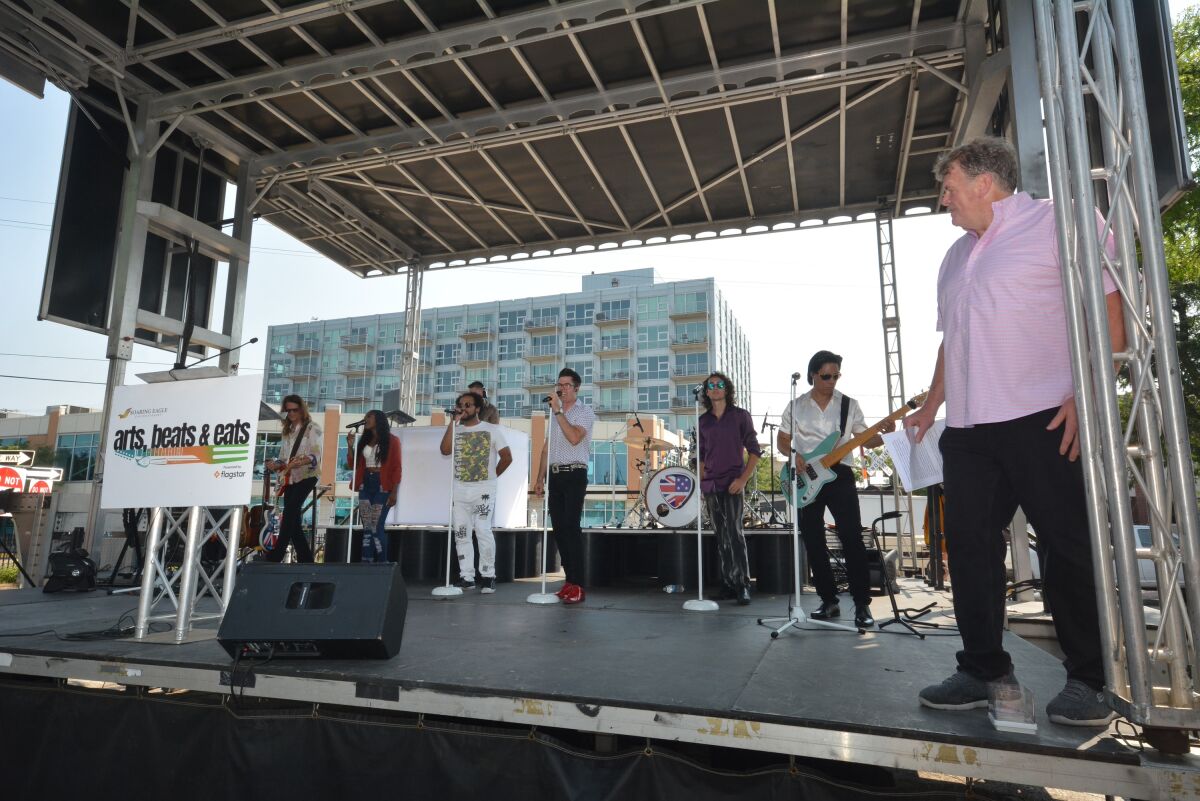  Event Producer Jon Witz on July 31 introduces the many musical acts that will play at the 2024 Arts, Beats & Eats festival over Labor Day weekend. The band Your Generation in Concert helps to introduce the performers by singing some of their well-known songs.  