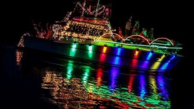  An illuminated boat sails on the Clinton River during a past edition of the Harrison Township Parade of Lights. 