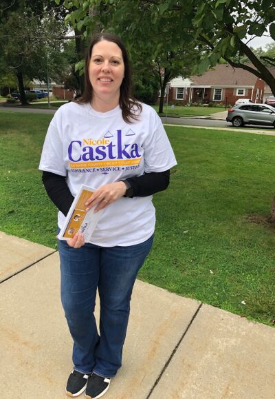  Outside Maire Elementary School in Grosse Pointe City, Kelly Laurenceau campaigns for Wayne County Circuit Court judicial candidate Nicole Castka. 