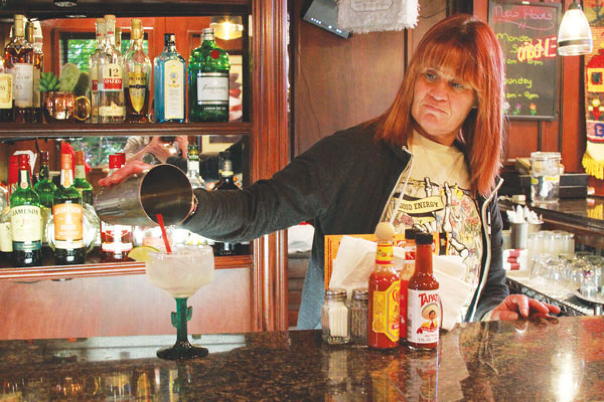  Crazy Gringo’s Clinton Township Manager Dawn Mathews makes a margarita at the bar. 