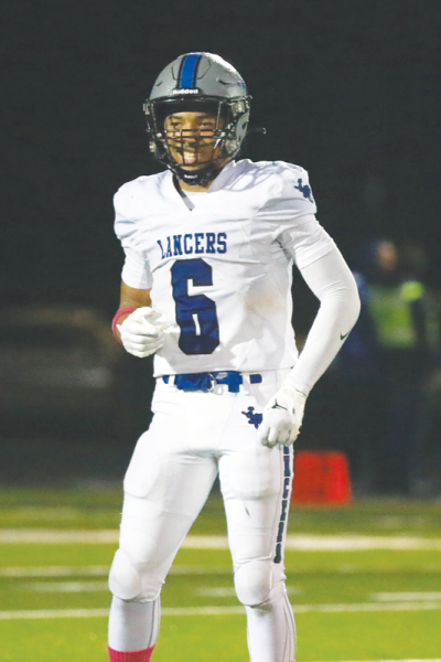  Harrison Township L’Anse Creuse senior Donovan Rey celebrates after scoring a touchdown. 