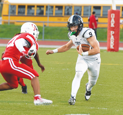  Troy senior Noah Oury carries the ball. 