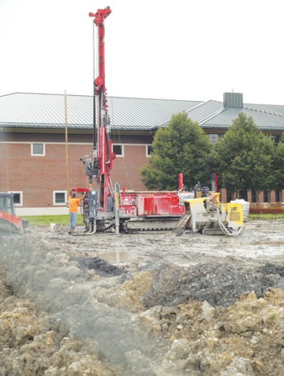  A drill digs a 500-foot hole into the ground behind the CMPL’s Main Library, allowing for the construction of a geothermal heating and cooling well. A geothermal HVAC system is one piece of the ongoing construction at the branch. 