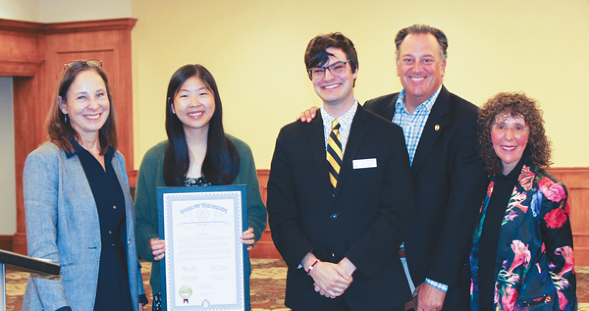  Oakland University student Emma Bowen, from Sterling Heights, second from left, receives a  special tribute from the state of Michigan for winning a contest themed around free speech.  