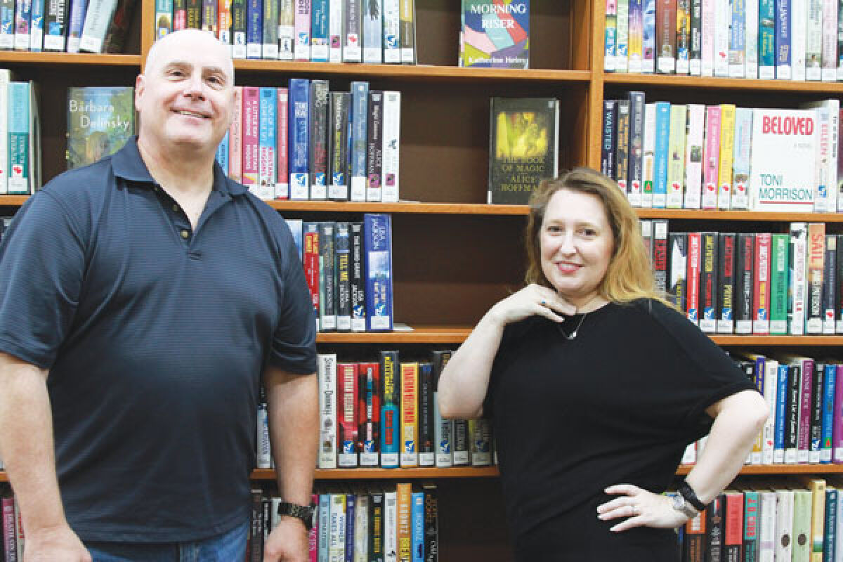  Fraser Library Board of Trustees Vice President Jim Sutherland, left, and Library Director Lorena McDowell pose for a picture at the library on Aug. 1. 