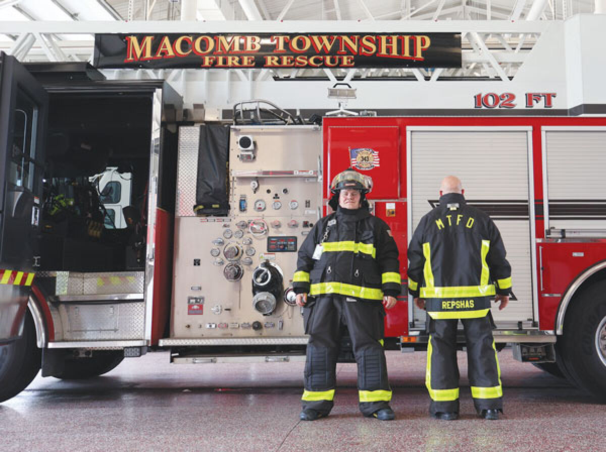  Macomb Township firefighters Kevin Leder, in helmet, and Joe Repshas show off the new turnout gear for the department’s 29 full-time firefighters. 