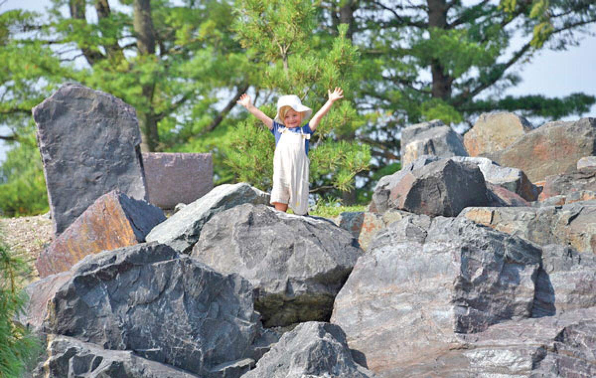  Wallace Mackie, 4, enjoys the Boulder Garden at Carpenter Lake Nature Preserve. 