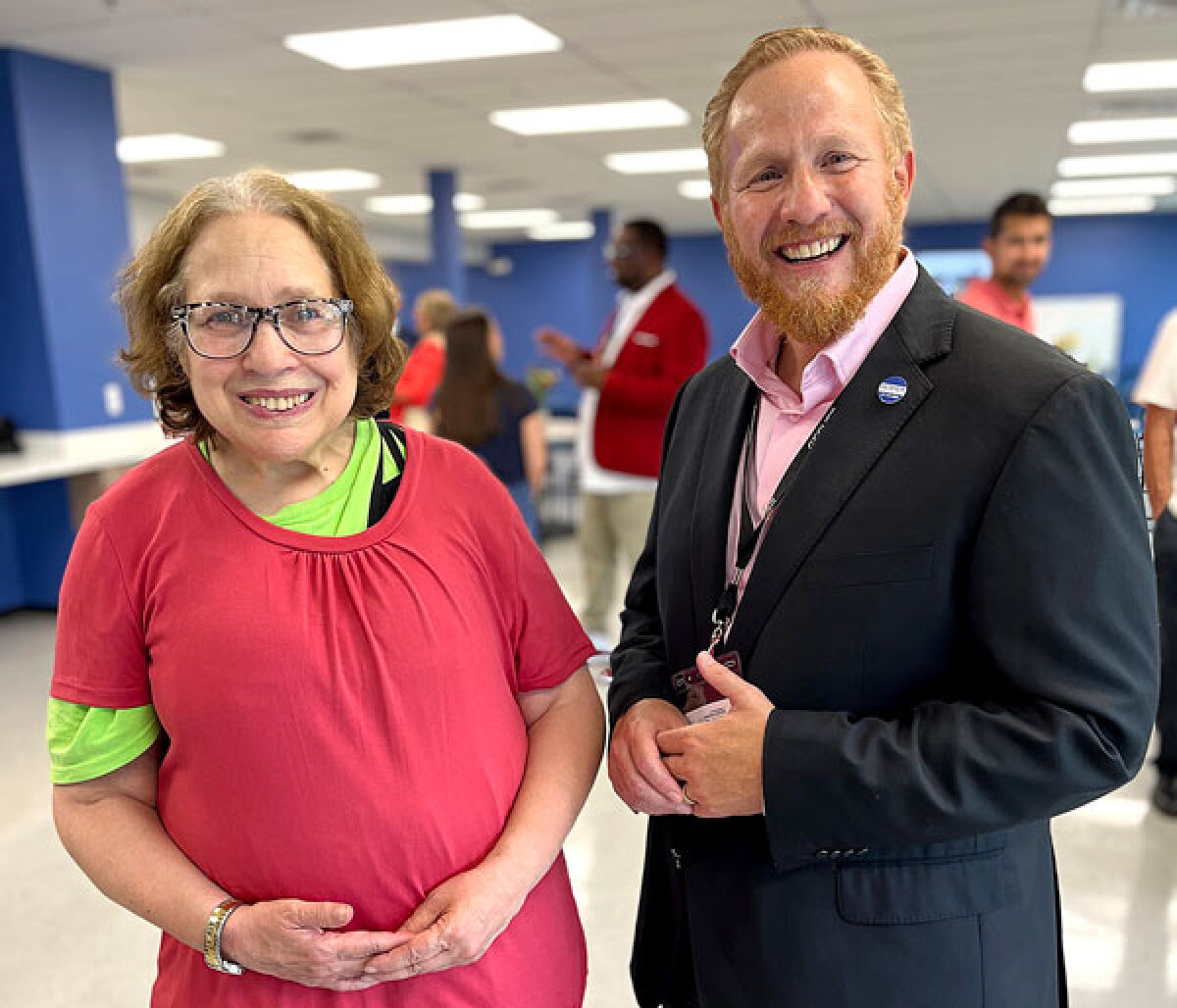  Paul J. Blatt, CEO of Gesher Human Services, attends the open house with Clubhouse member Sharon Glazer Aug. 8 for the new 8,676-square-foot Lois and Milton Zussman Center in the Vanguard Center. 