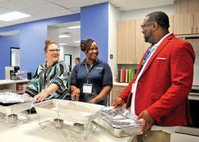  Rene Dell, Molisia Young and Clifton Phillips in the kitchen area at the new Zussman Center. 