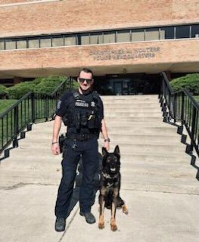  Officer Nicholas Hofer and officer Kantor in front of Christopher M. Wouters Police Headquarters.  