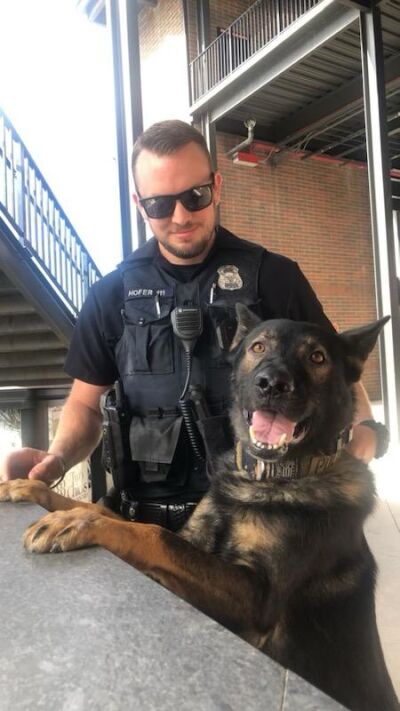  Officers Nicholas Hofer and Kantor at the counter ready for their next assignment. “Kantor is the best partner I could have asked for,” Hofer said. 