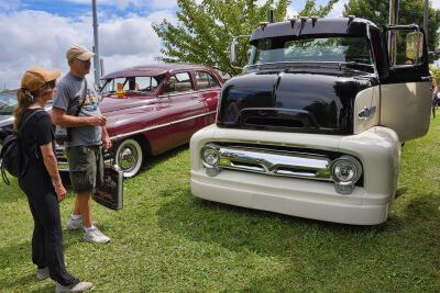  Allison Raymoure and her dad, Bob Raymoure, of Royal Oak, admire a 1945 Ford truck on display at the Performance Park Classic Car Show Aug. 17. 