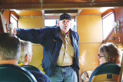  Ashley Messenger, who pilots the Liberty Aviation Museum’s 1928 Ford Tri-Motor, addresses passengers before a flight.  