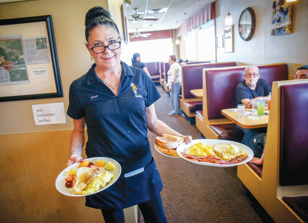  Josie Briggs serves up breakfast at The Pantry Restaurant in Sterling Heights. Some restaurant or business organizations have reacted to a recent Michigan Supreme Court ruling and its resulting, upcoming changes to minimum wage and paid sick leave requirements. 