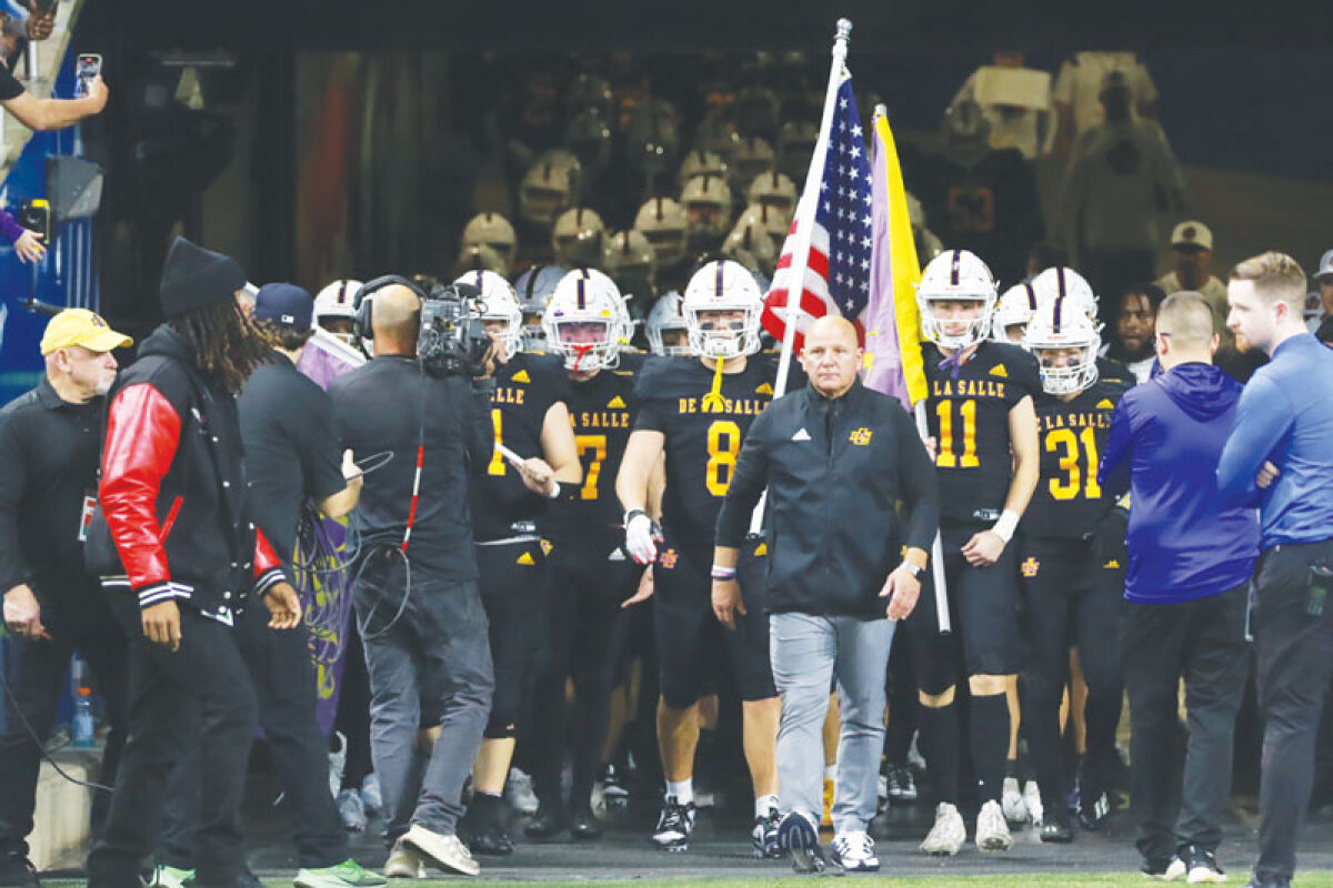  Warren De La Salle prepares to take the field at the Michigan High School Athletic Association Division 2 state championship game on Nov. 26 at Ford Field. 