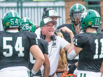  Novi head coach Jim Sparks has a conversation with his players during a game last season. 