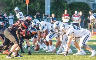  Utica and Macomb Dakota line up against each other during a game last season. 