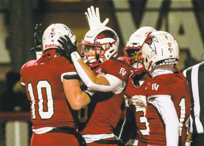  Clinton Township Chippewa Valley players celebrate a touchdown last season. 