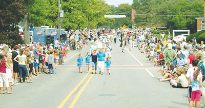  Families and friends line up for a parade during a  past Franklin Round Up. 