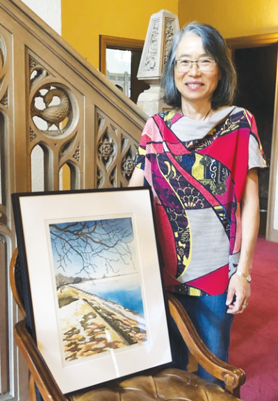  Grosse Pointe Shores artist Nobuko Yamasaki stands next to “Winter Sky,” one of the artworks that will be in her upcoming solo exhibition at University Liggett School in Grosse Pointe Woods. 