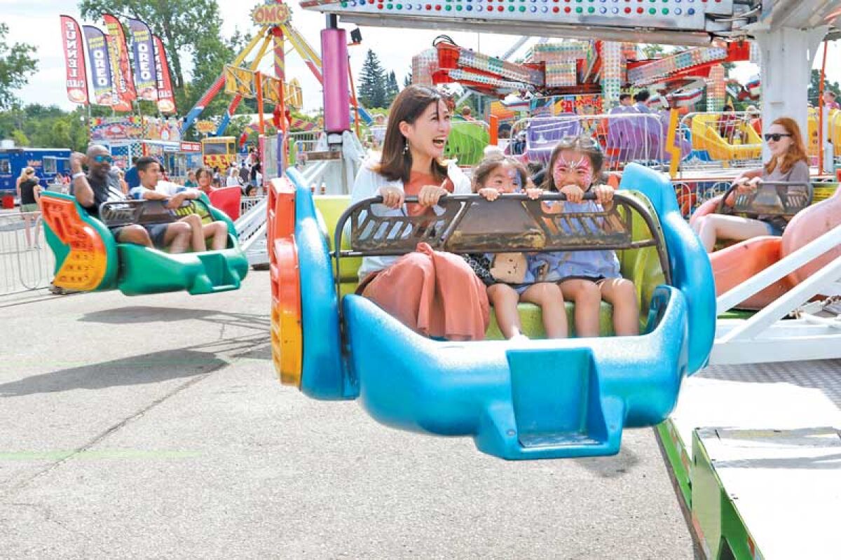  Fairgoers enjoy the Scrambler at the Michigan State Fair at Suburban Collection Showplace in Novi in 2023. 