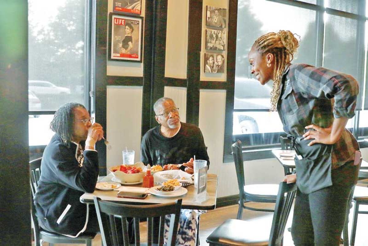  Cornbread, located at 29852 Northwestern Highway, has been a Southfield staple for almost 30 years. Euzetta Daniel is pictured with customers. 