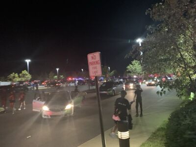  Many police lights are visible in the distance at the Michigan State Fair in response to a shooting Aug. 31. 