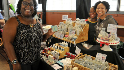  Camilla Rice is joined by her children, nine-year-old Miles and 17-year-old Selah, at her booth during the Diversity Expo.  