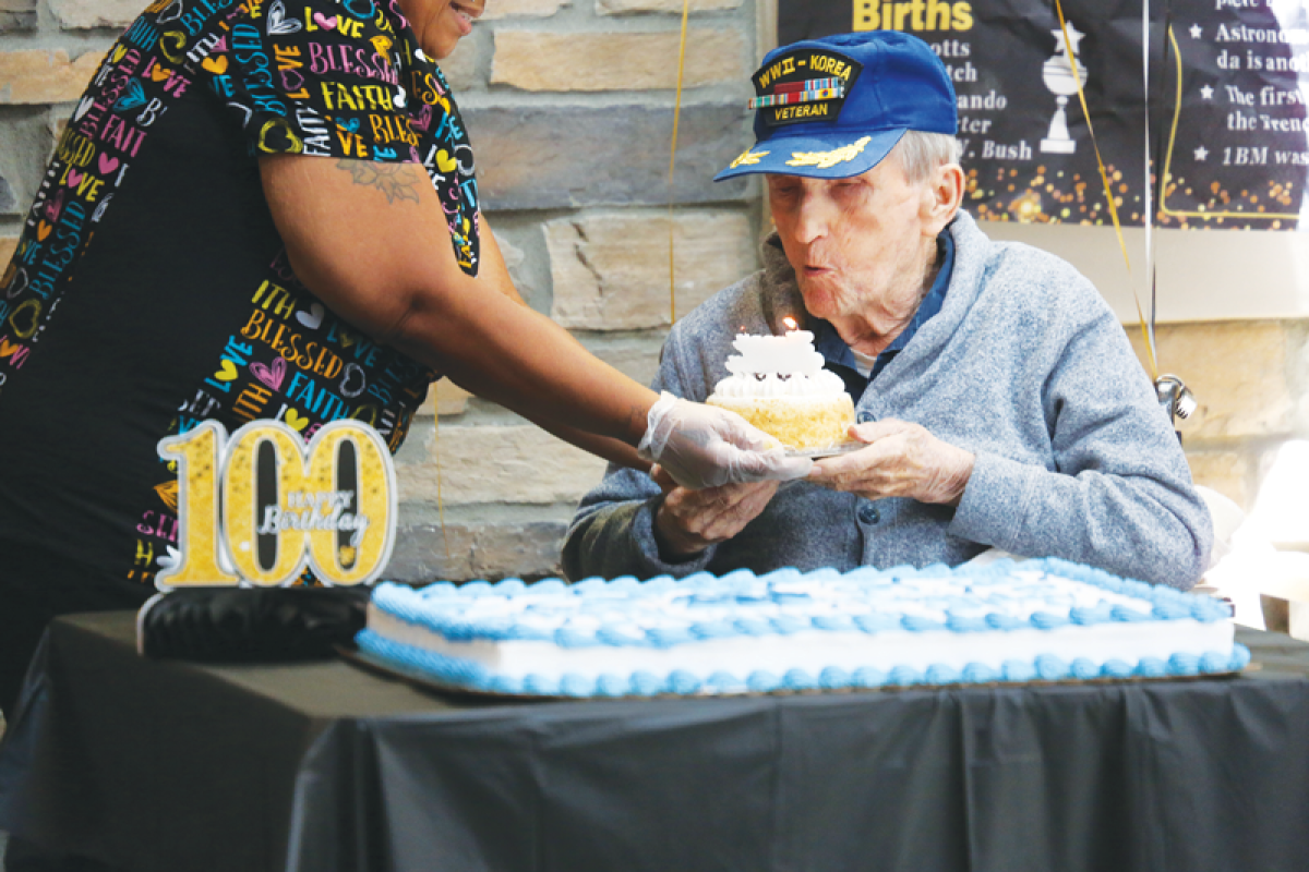  William Szypa, a centenarian and veteran of two wars, blows out birthday candles at a celebration in Mount Clemens on Sept. 3. Szypa was born on Aug. 31, 1924.  