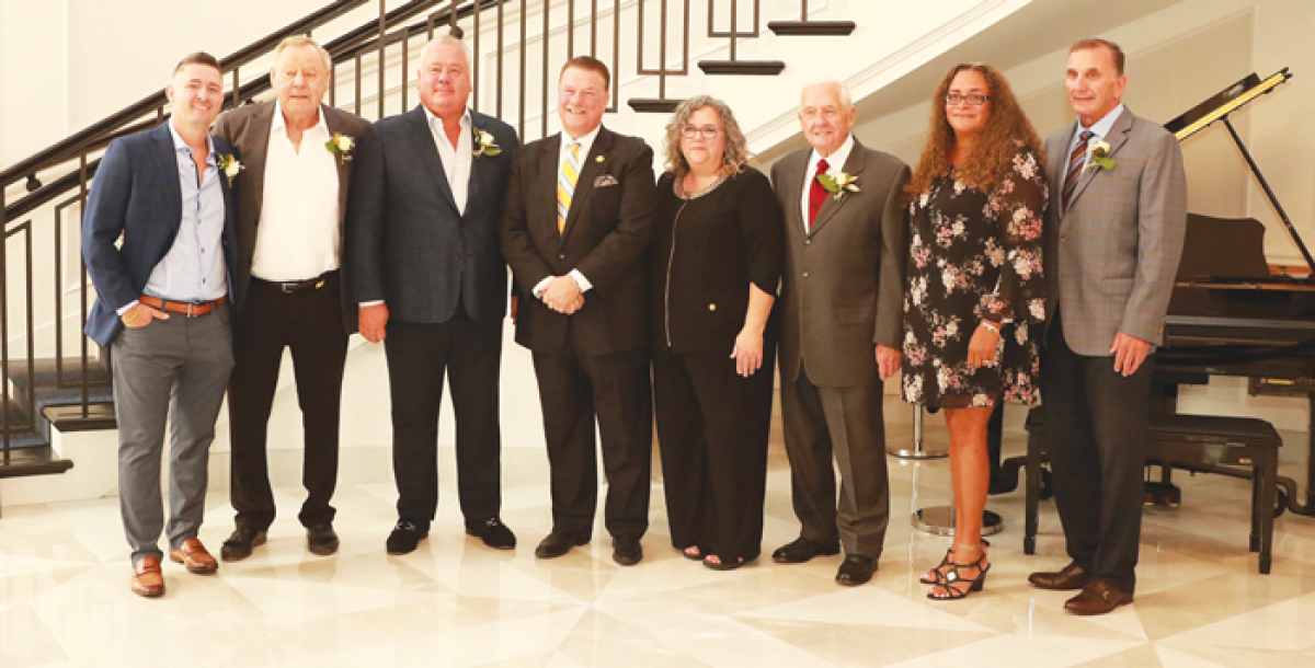  New members of the Macomb County Hall of Fame Chris Holsbeke II, left; Raymond Holsbeke, second from left; Chris Holsbeke, third from left; Capt. Luke Clyburn, third from right; Dorie Vázquez-Nolan, second from right; and Michael Schodowski, right, pose for a photo with Macomb County Prosecutor Peter Lucido and President and CEO of the Macomb County Chamber of Commerce Kelley Lovati Aug. 15 at the Palazzo Grande Banquet and Event Center in Shelby Township. 