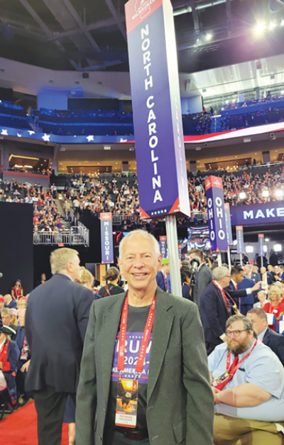  Ronald Singer of Warren, a delegate at the Republican National Convention, representing the 10th Congressional District, makes  his way around the convention floor.  