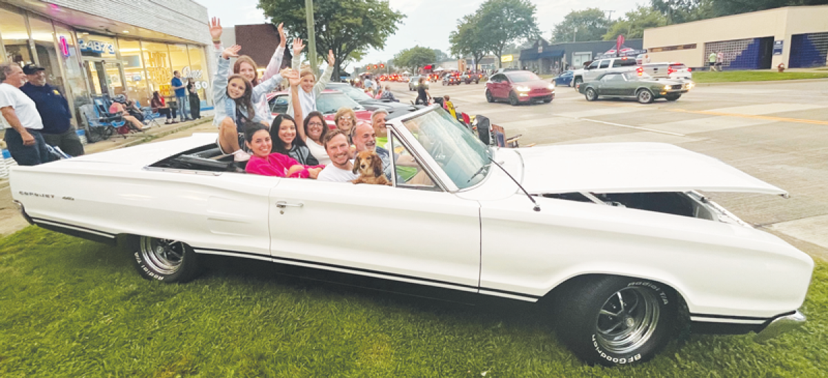   John Marino, pictured at the steering wheel, brought his 1967 Dodge Coronet 440 convertible to the annual Shorewood Kiwanis Club of St. Clair Shores Harper Charity Cruise Aug. 28. A number of family members and friends joined in, as did a family pet, a dachshund named John. 