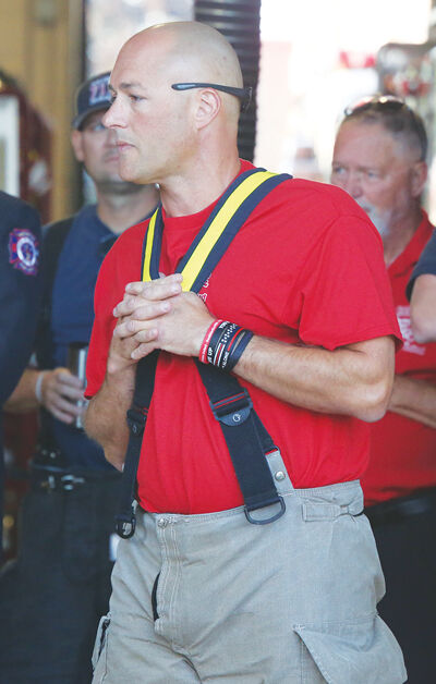  Joe Warne, Neighbors United president and a Macomb Township firefighter, listens to a speaker at the #walkfortheRED kickoff event at Macomb Township’s Station 2 on Sept. 5. Warne began the statewide walk after learning cancer is the leading cause of firefighter deaths. 