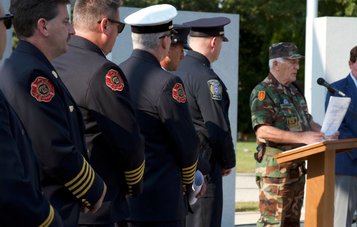  Vietnam Veterans of America 154 Assistant Chaplain Mike Schneider delivers the invocation  at Patriot Day observance on Sept. 11 at Resurrection Cemetery in Clinton Township. 