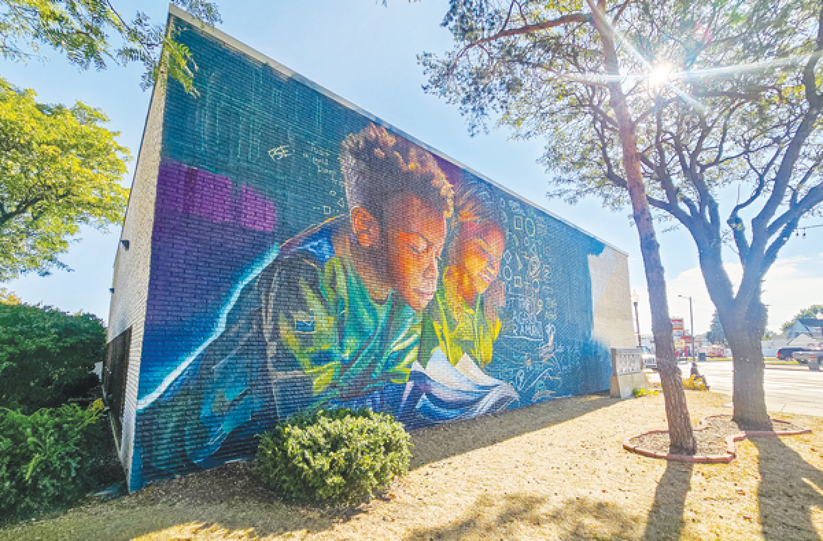  A mural on the facade of the Hazel Park District Library was on the cusp of completion Sept. 17. The artist is Zach Curtis, and the project was made possible with funding from the Detroit Institute of Arts. 