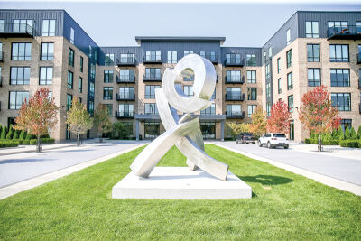  The Apex West Bloomfield, like the nearby Town Court apartments, features a variety of modern amenities for residents. Pictured is a sculpture by artist Rob Lorenson. 