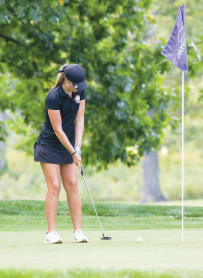  Utica junior Riley Burton putts during a league matchup against St. Clair. 