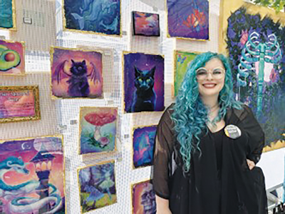  Megan “Maude” Litts, of Maude Studios, shows some of her artwork at the Funky Ferndale Art Fair. 